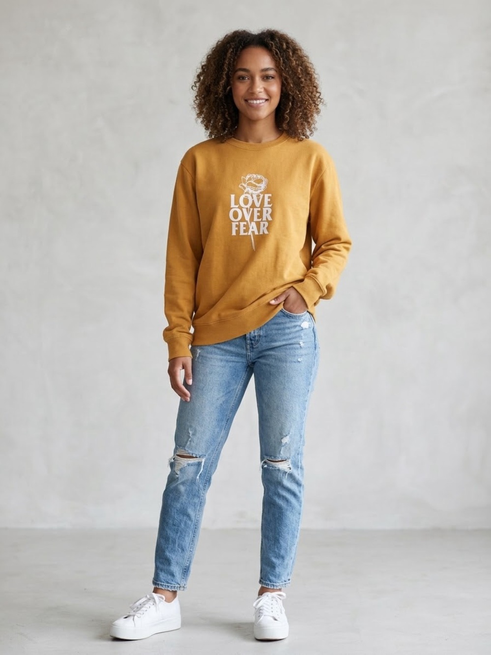 Seek Discomfort Organic Cotton Love  Over Fear Graphic  Sweatshirt - Mustard